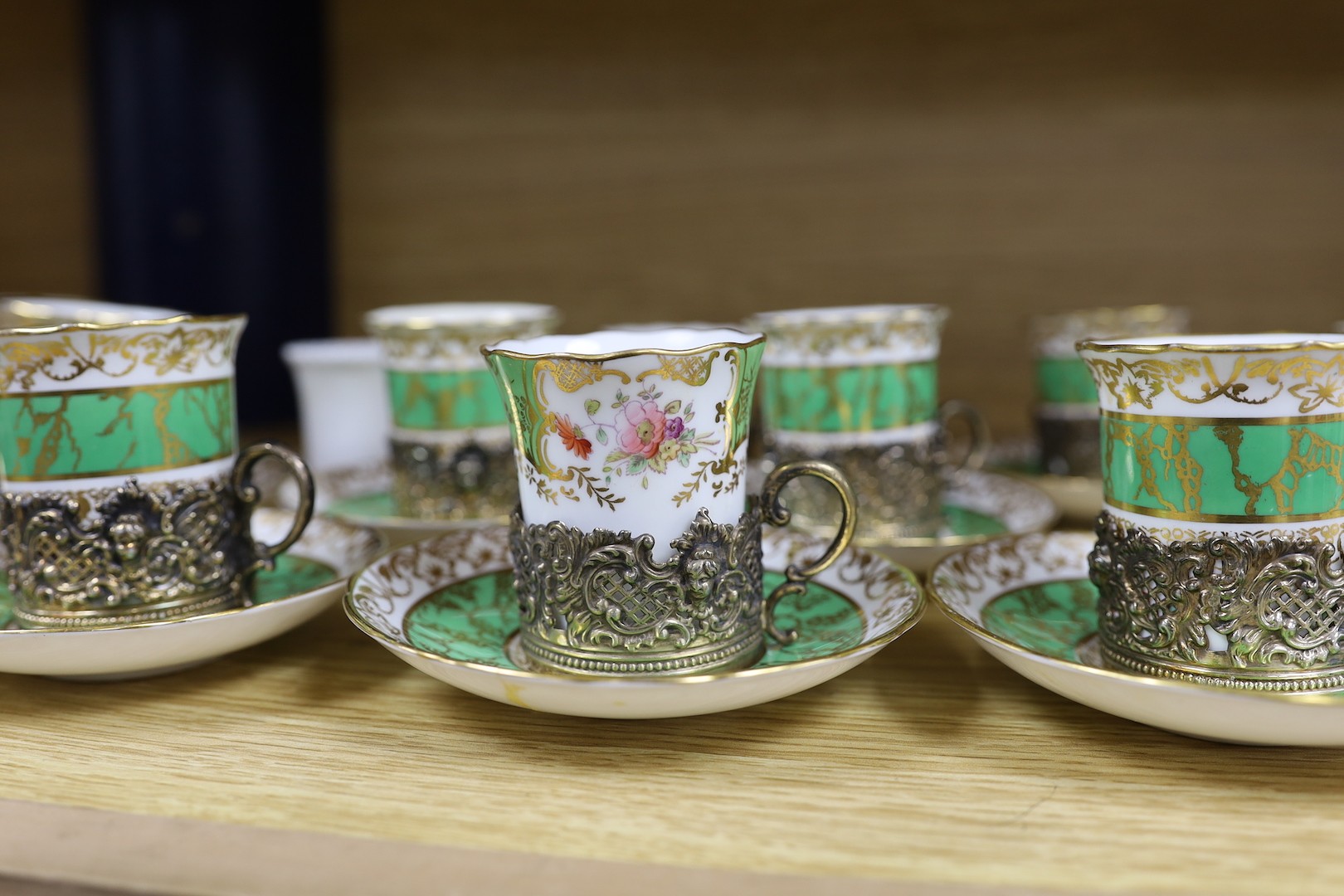 A Hammersley & Co porcelain coffee set with associated silver gilt cup holders